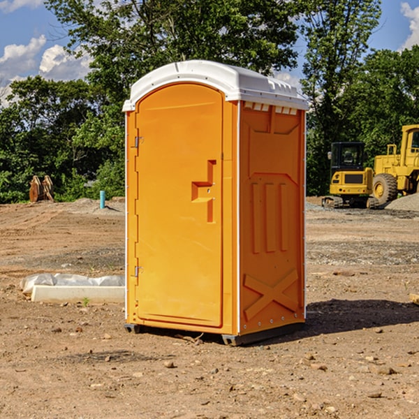 what is the cost difference between standard and deluxe portable toilet rentals in Bedford